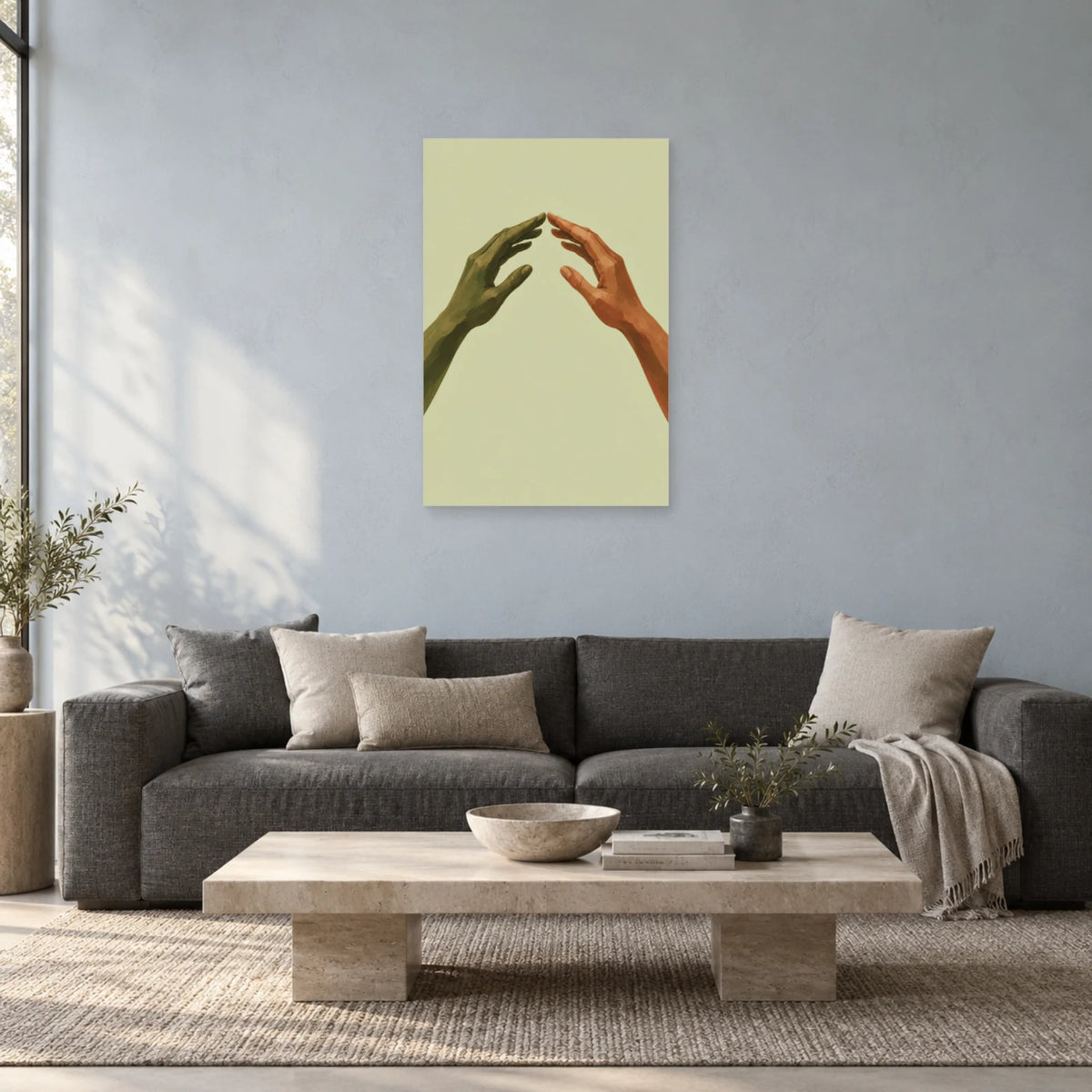 Open-arch hands poster above a charcoal sofa and pale rectangular coffee table