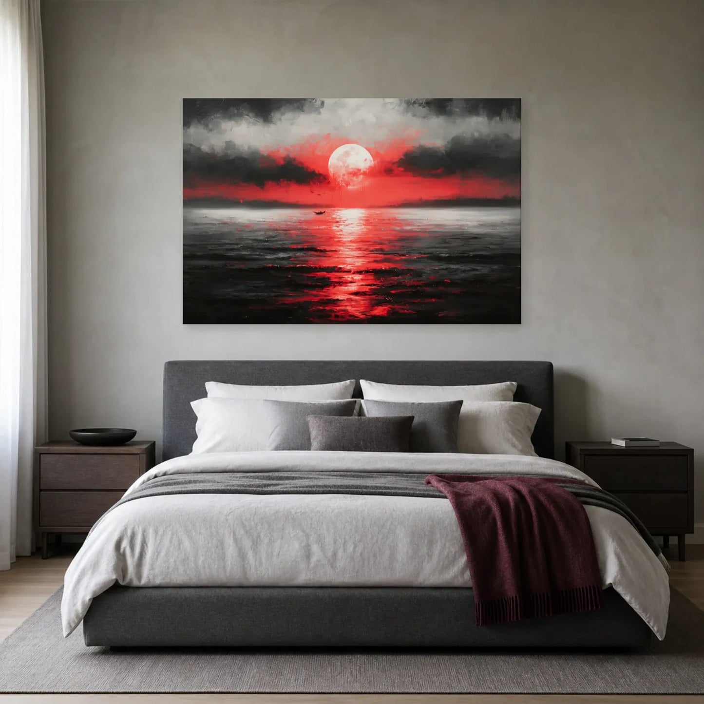 Tableau lune rouge sur la mer présenté dans une chambre