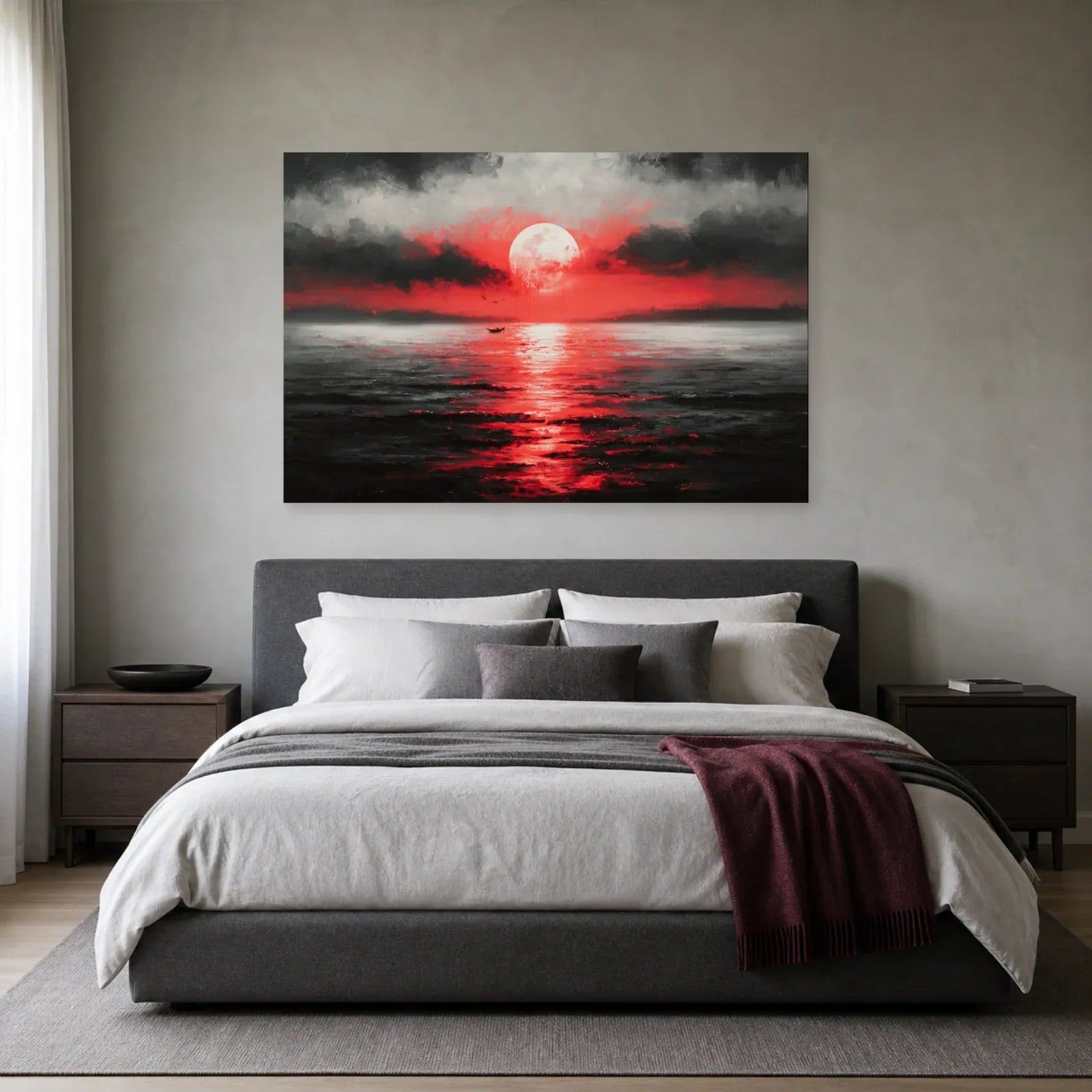 Tableau lune rouge sur la mer présenté dans une chambre